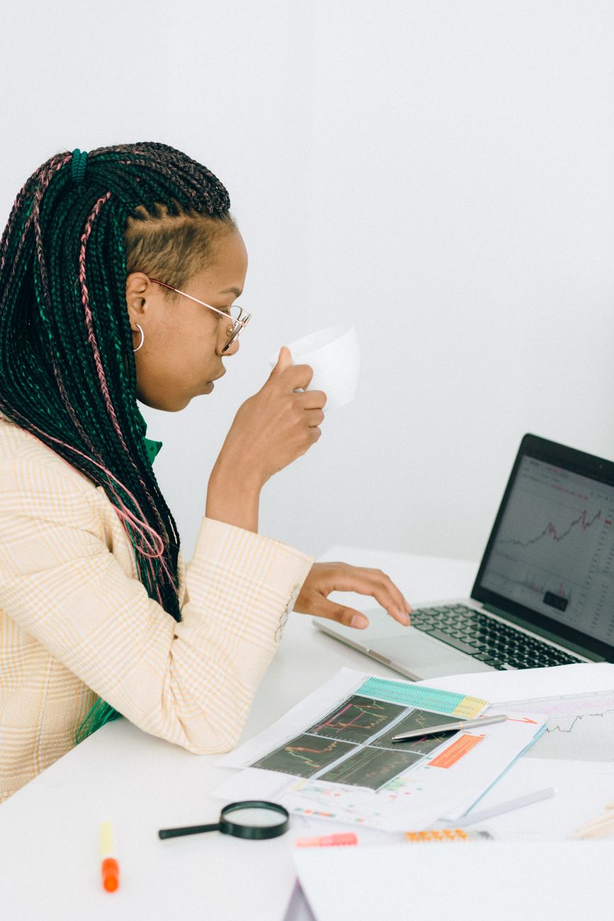 African entrepreneur using laptop for digital marketing and content creation