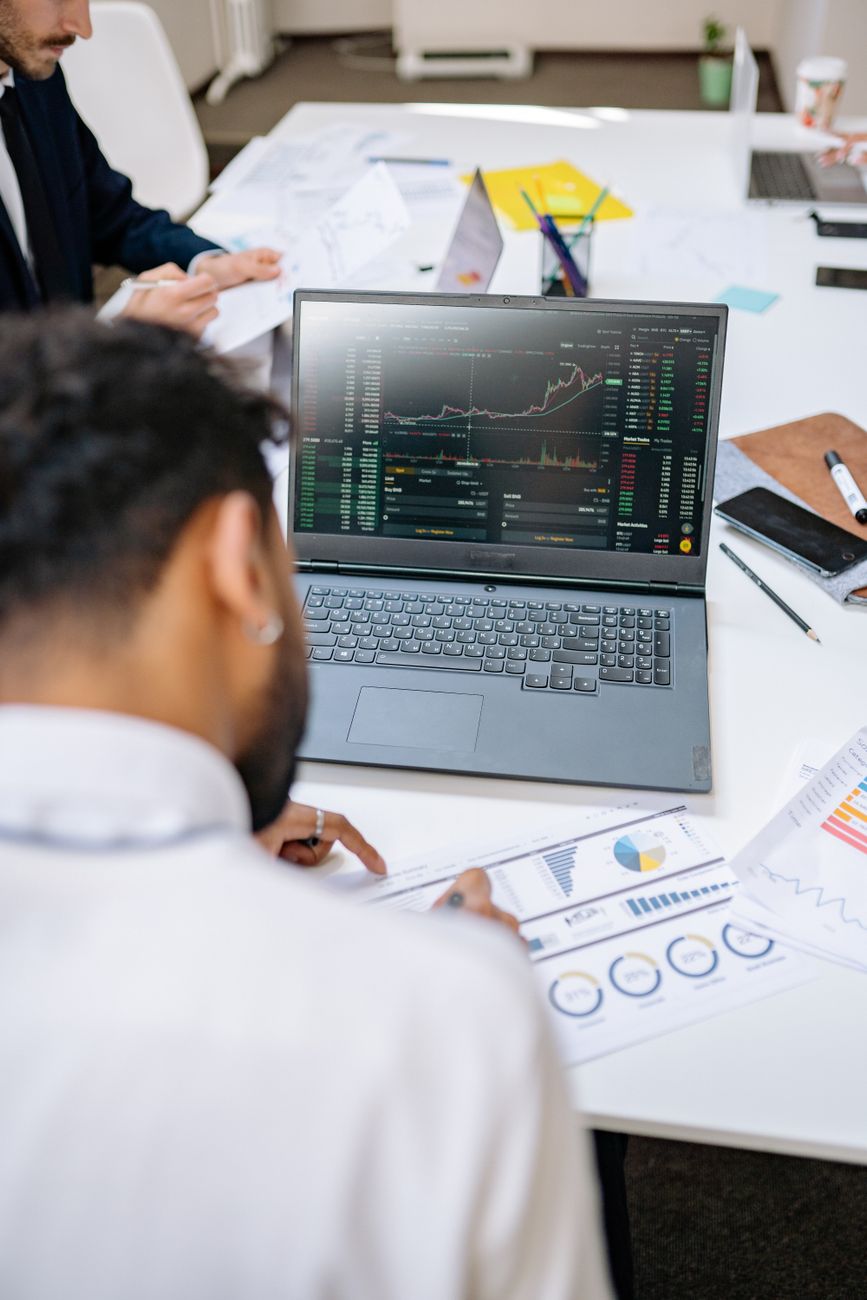 African brand team reviewing influencer analytics dashboard on laptop