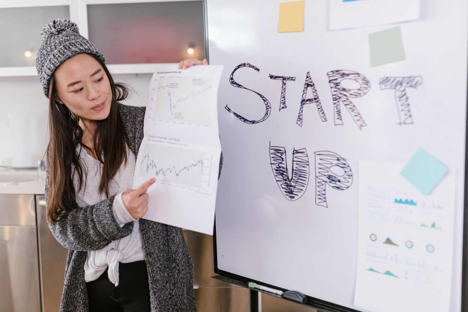 African female entrepreneur presenting at a startup pitch event