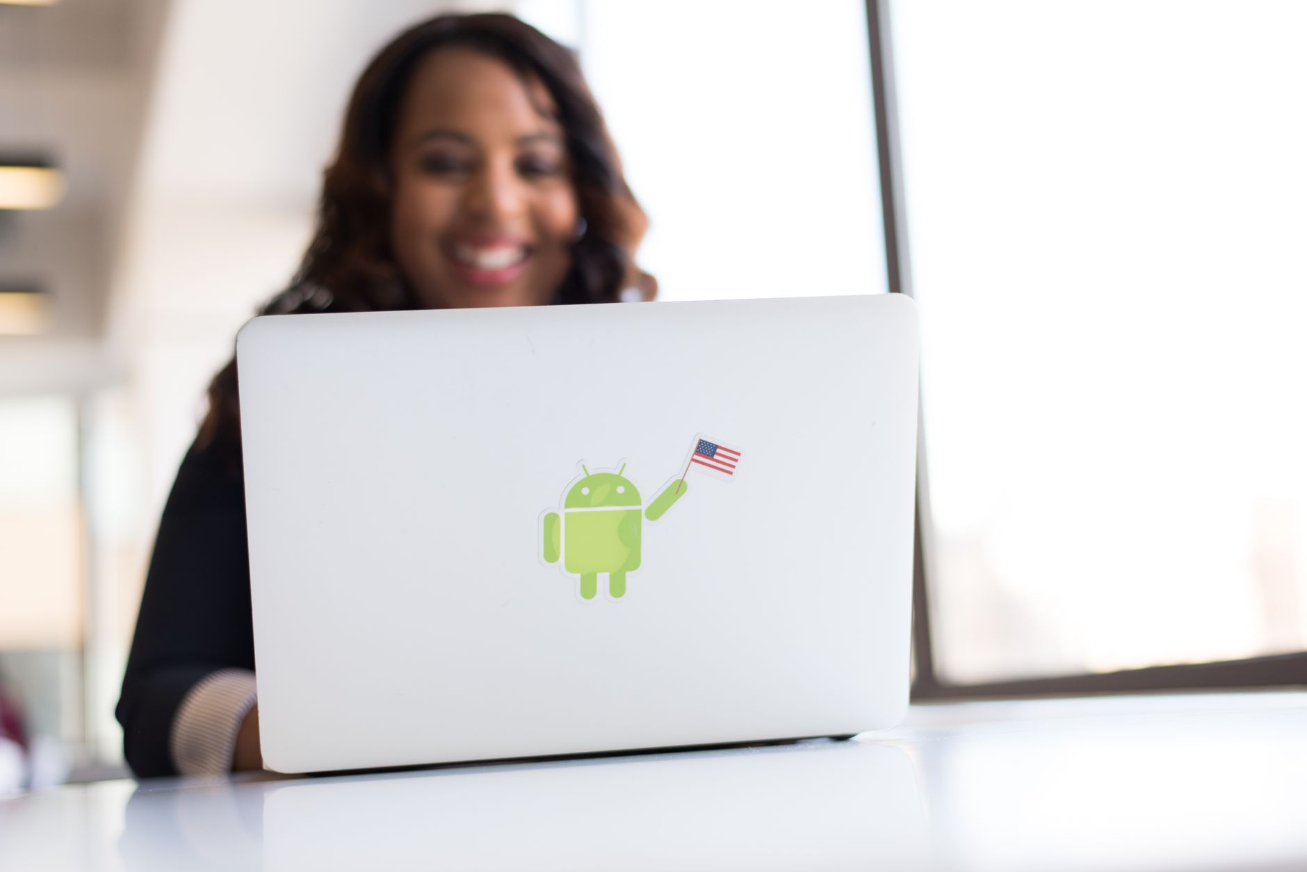 Tech startup team working on Google product in African city office