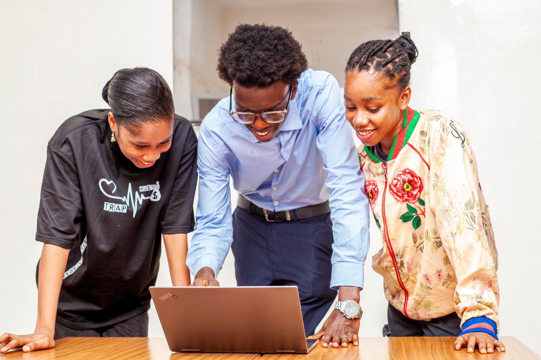 African brand marketing team reviewing creator profiles on a laptop