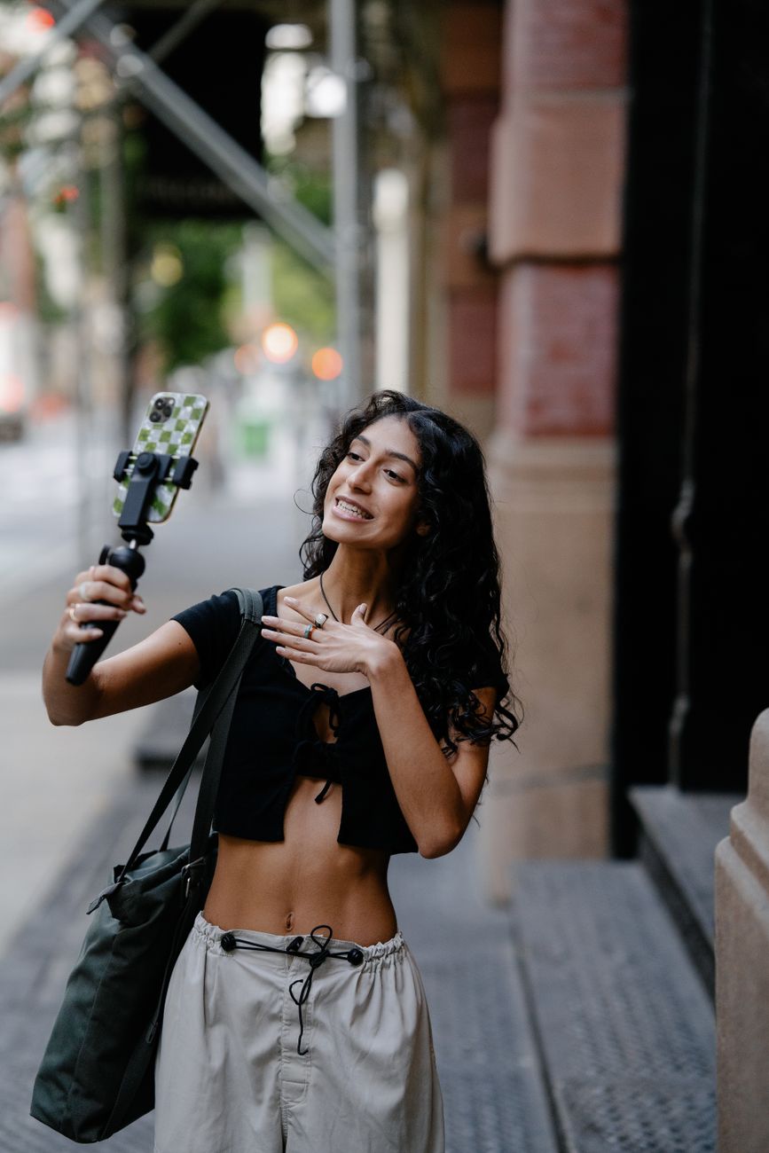 South African content creator filming a TikTok video in an urban setting