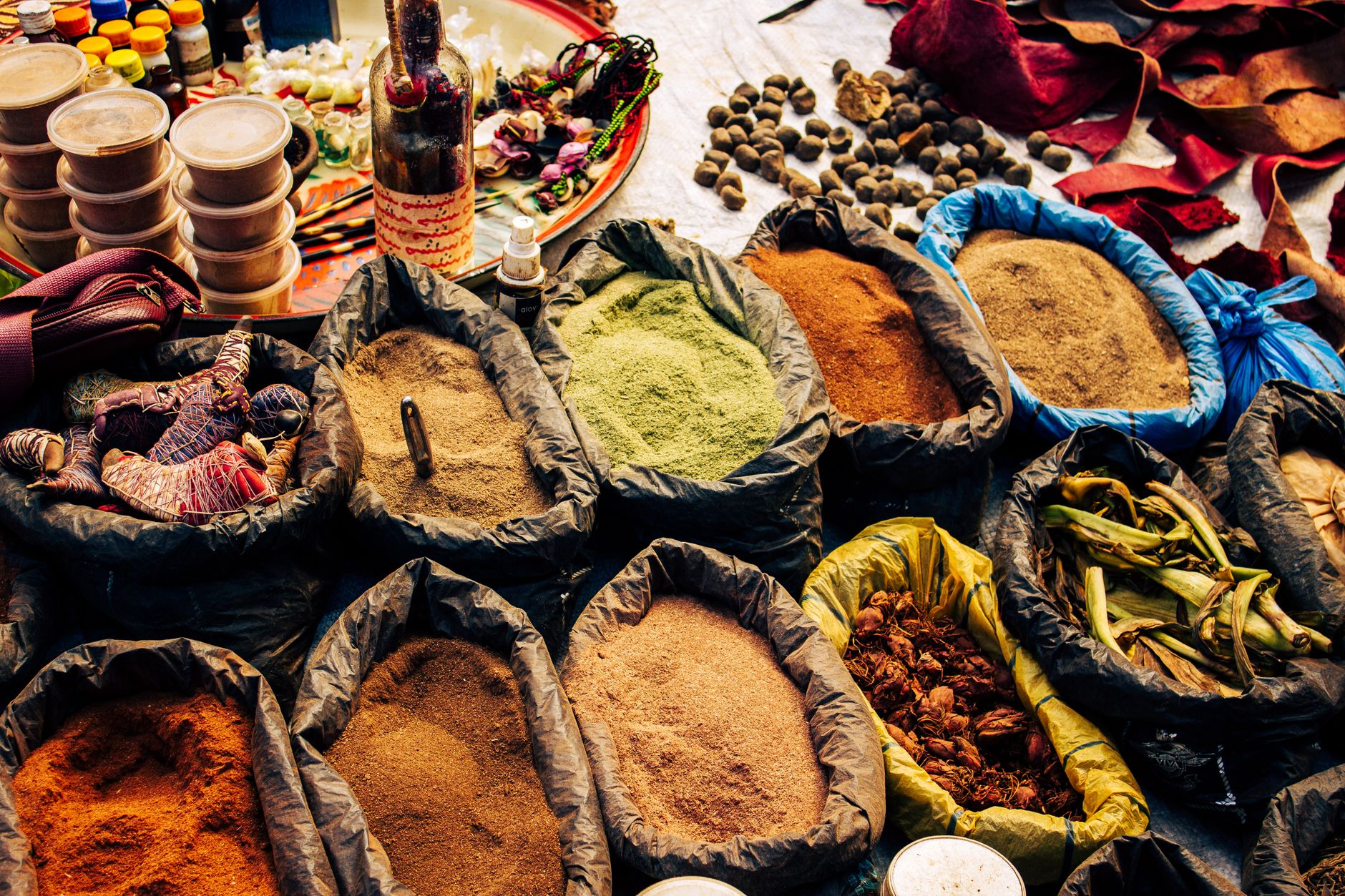 Premium spice blends and olive oil bottles with ethnic packaging design