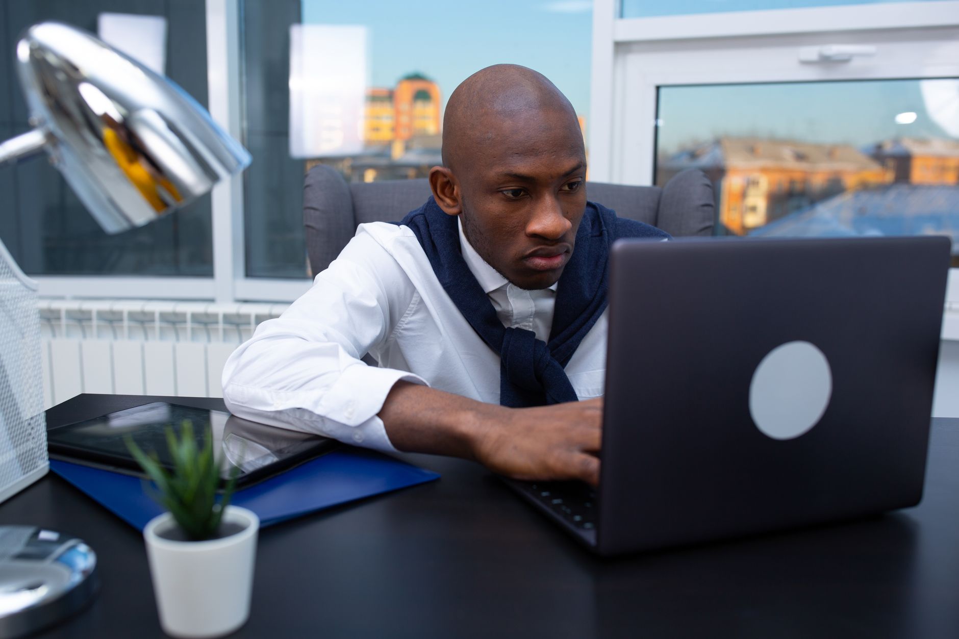 African tech entrepreneur using creator discovery platform on laptop