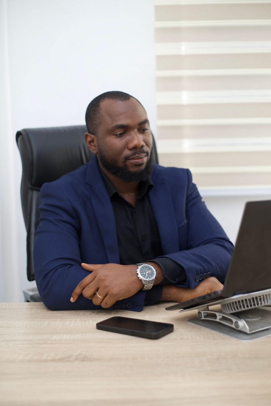 African diaspora entrepreneur using laptop for digital commerce and social media marketing