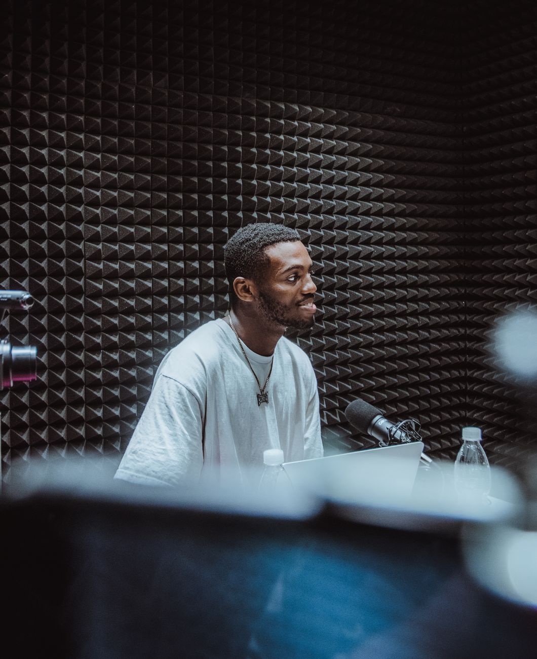 African content creator recording a video in a modern studio setup