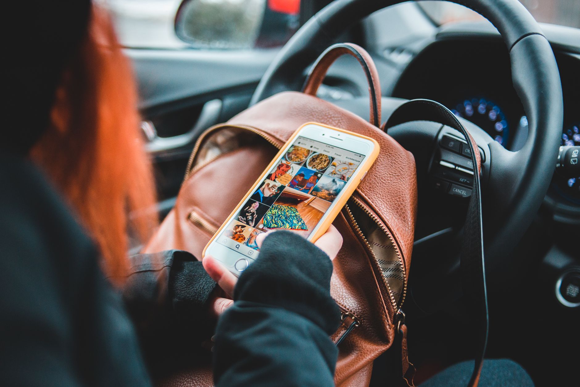 Smartphone showing social media analytics dashboard with engagement metrics
