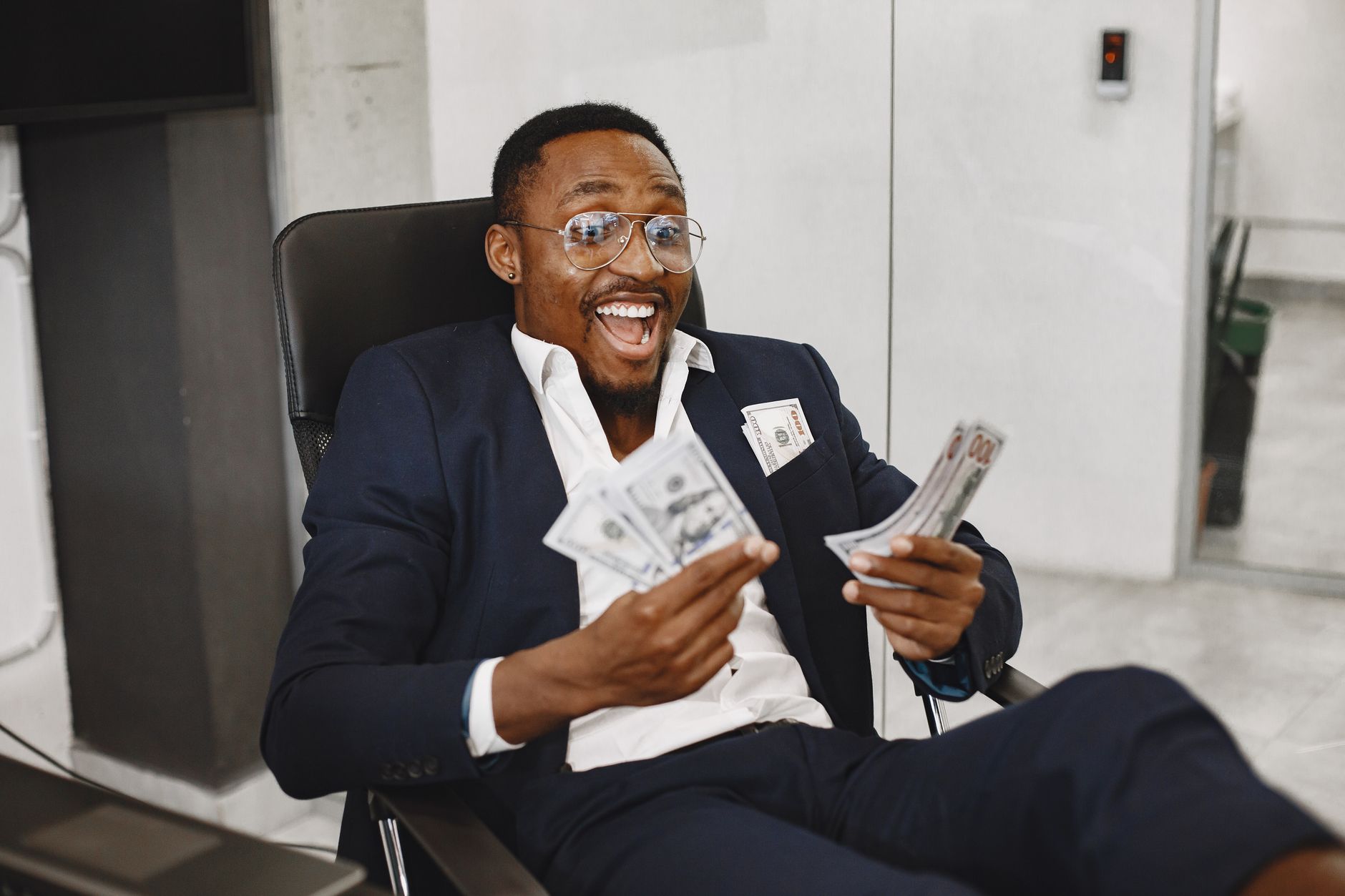 African entrepreneur reviewing revenue charts on a laptop at a desk