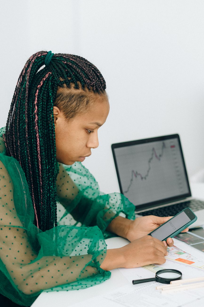 African entrepreneur reviewing social media analytics on a laptop
