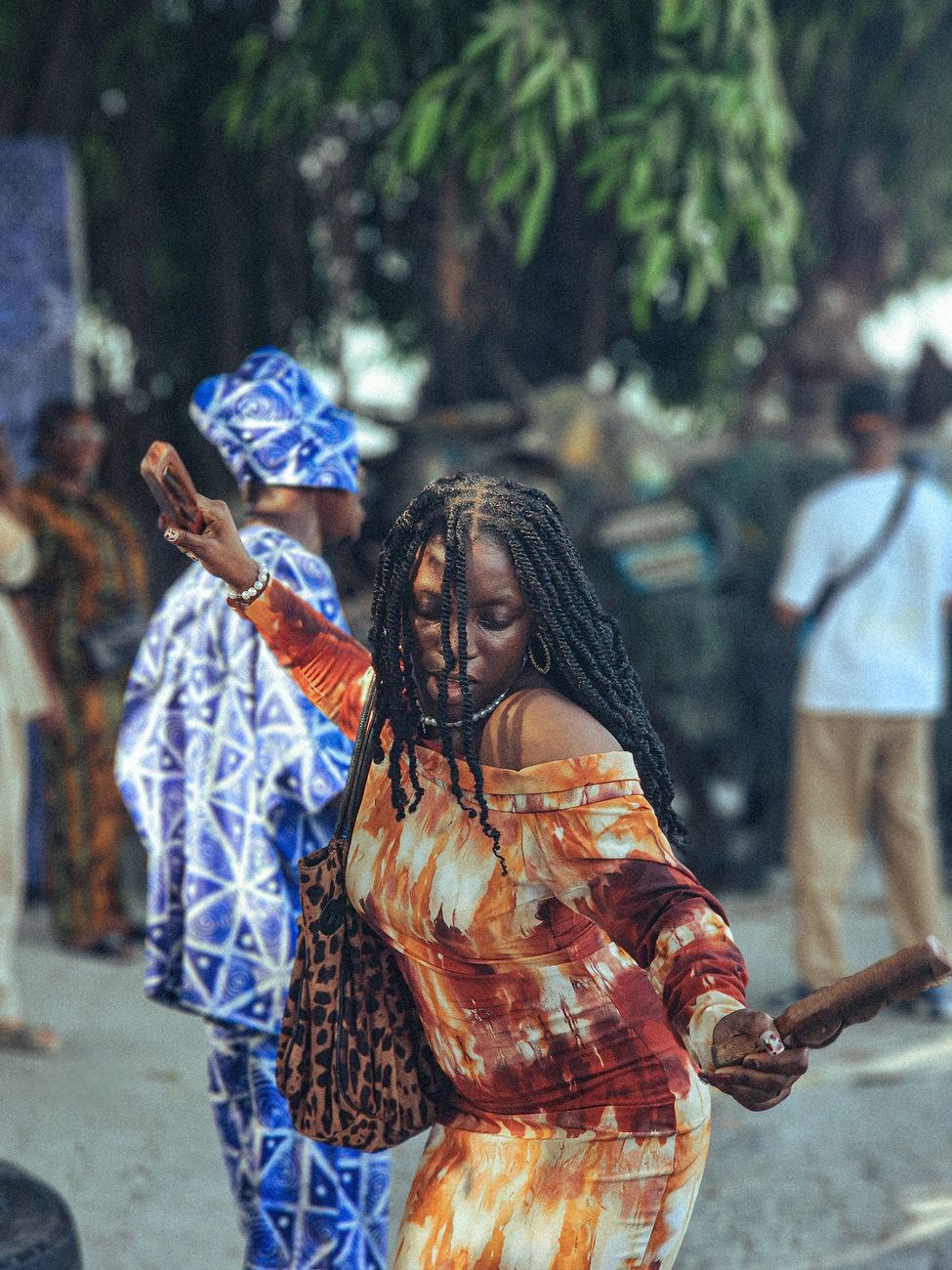 Young African woman demonstrating traditional dance moves in a short video