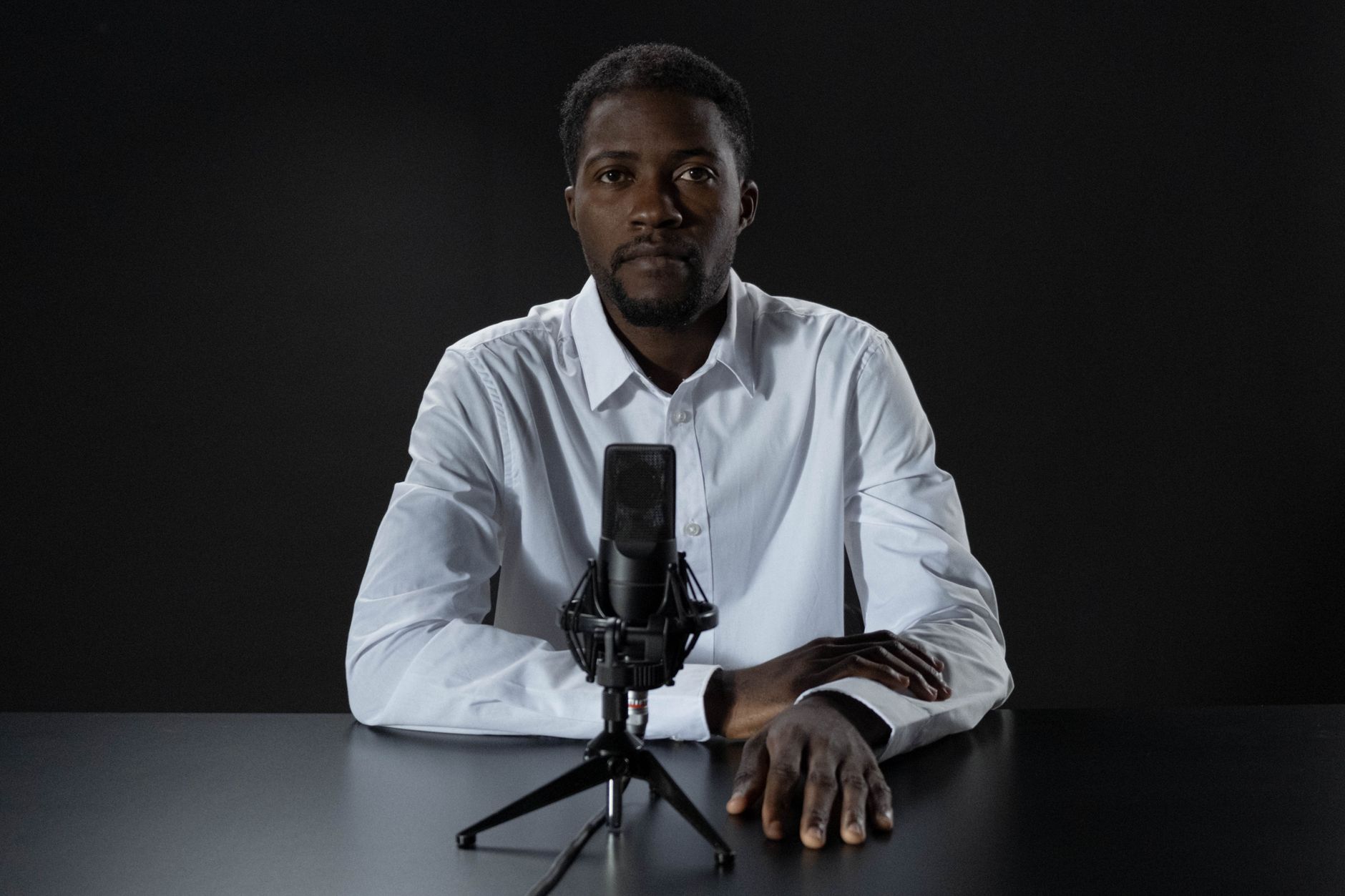 African podcast host recording episode about traditional African storytelling