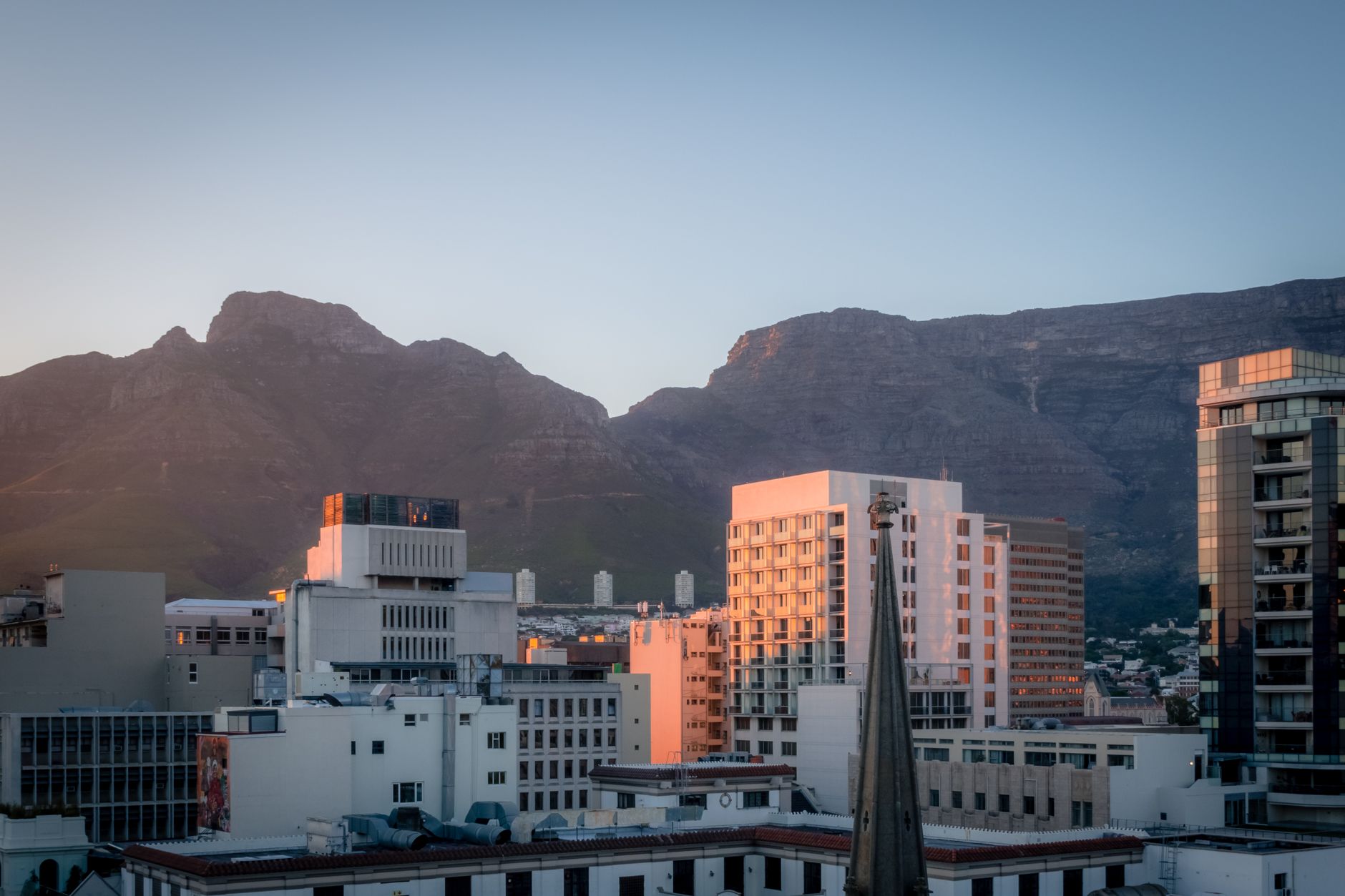 Aerial view of Cape Town city and Table Mountain at sunset