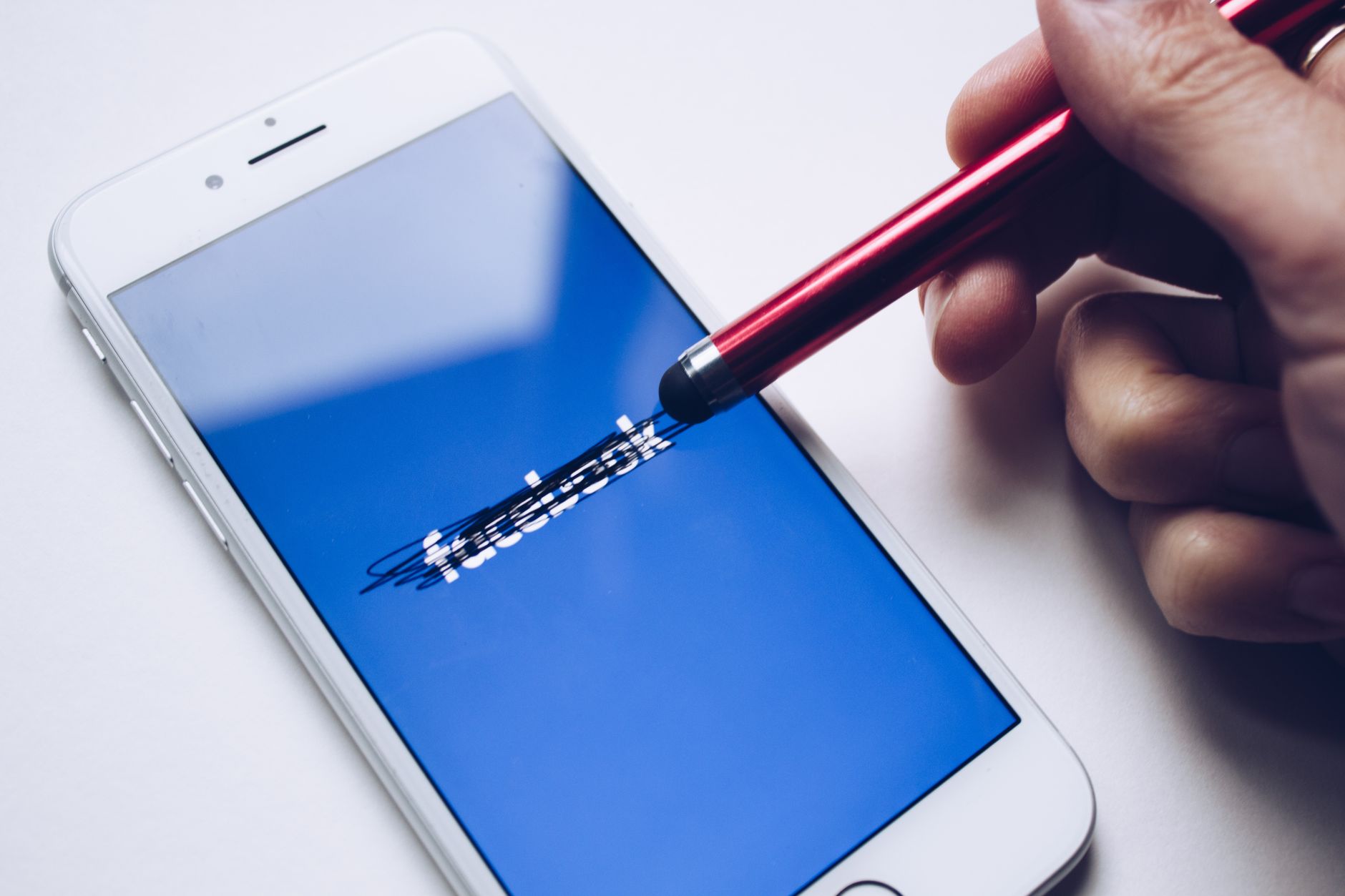 Facebook Groups community discussion on a mobile phone in Africa