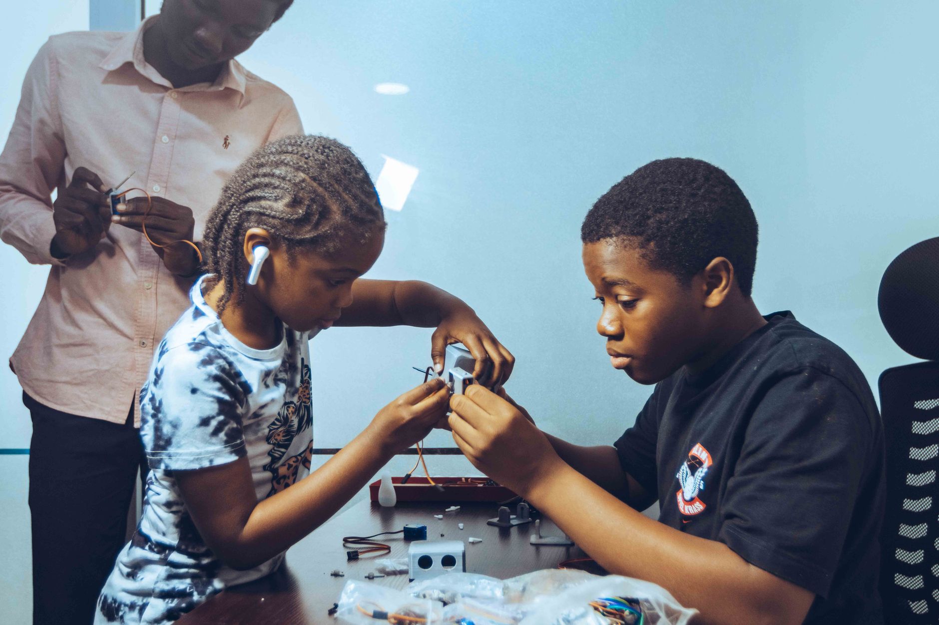 Tech innovation hub in Africa with young creators on laptops