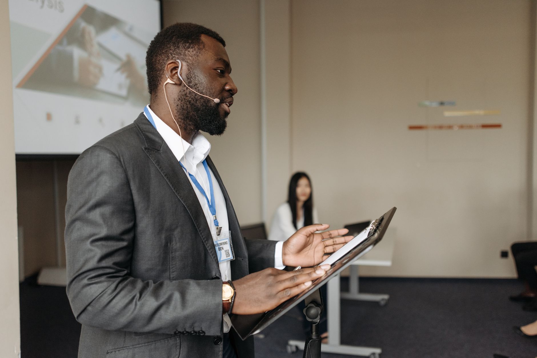 African entrepreneur presenting to an engaged audience at a business event