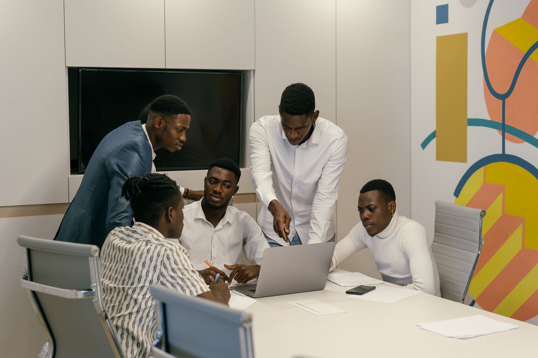 African business team reviewing content strategy and revenue data on a screen