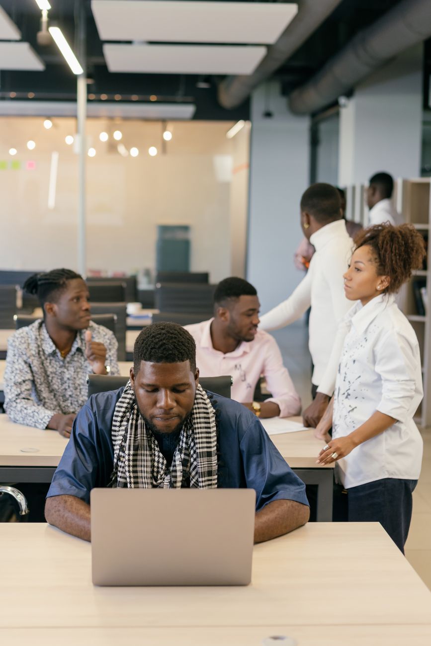 African entrepreneurs collaborating inside a modern innovation hub in Lagos
