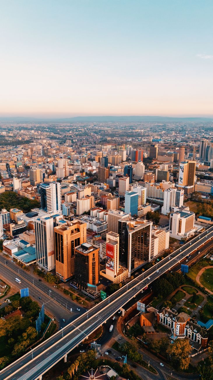 Aerial view of a vibrant African city tech district at dusk