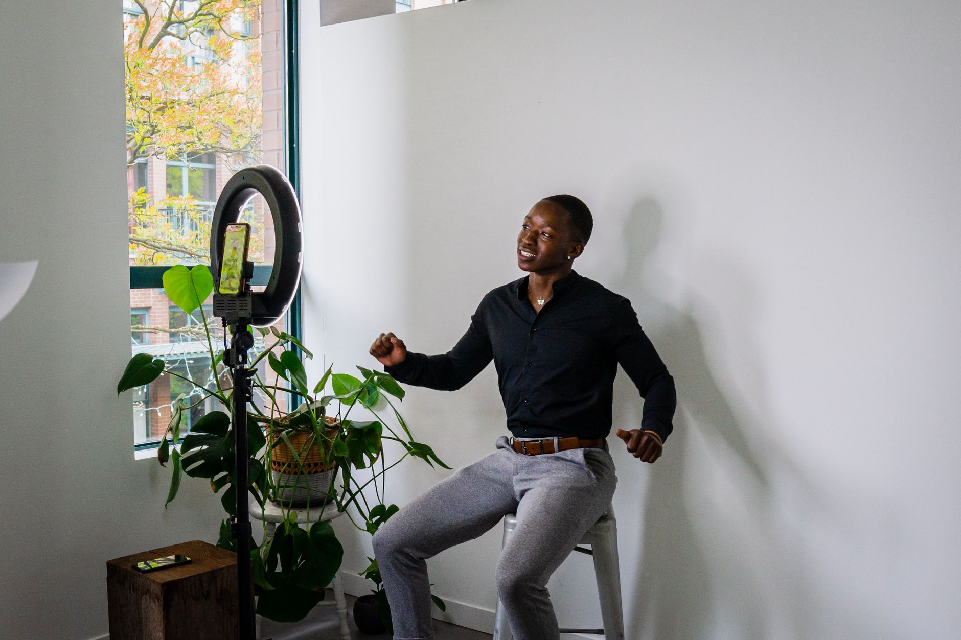 African creator filming content in a modern studio setup