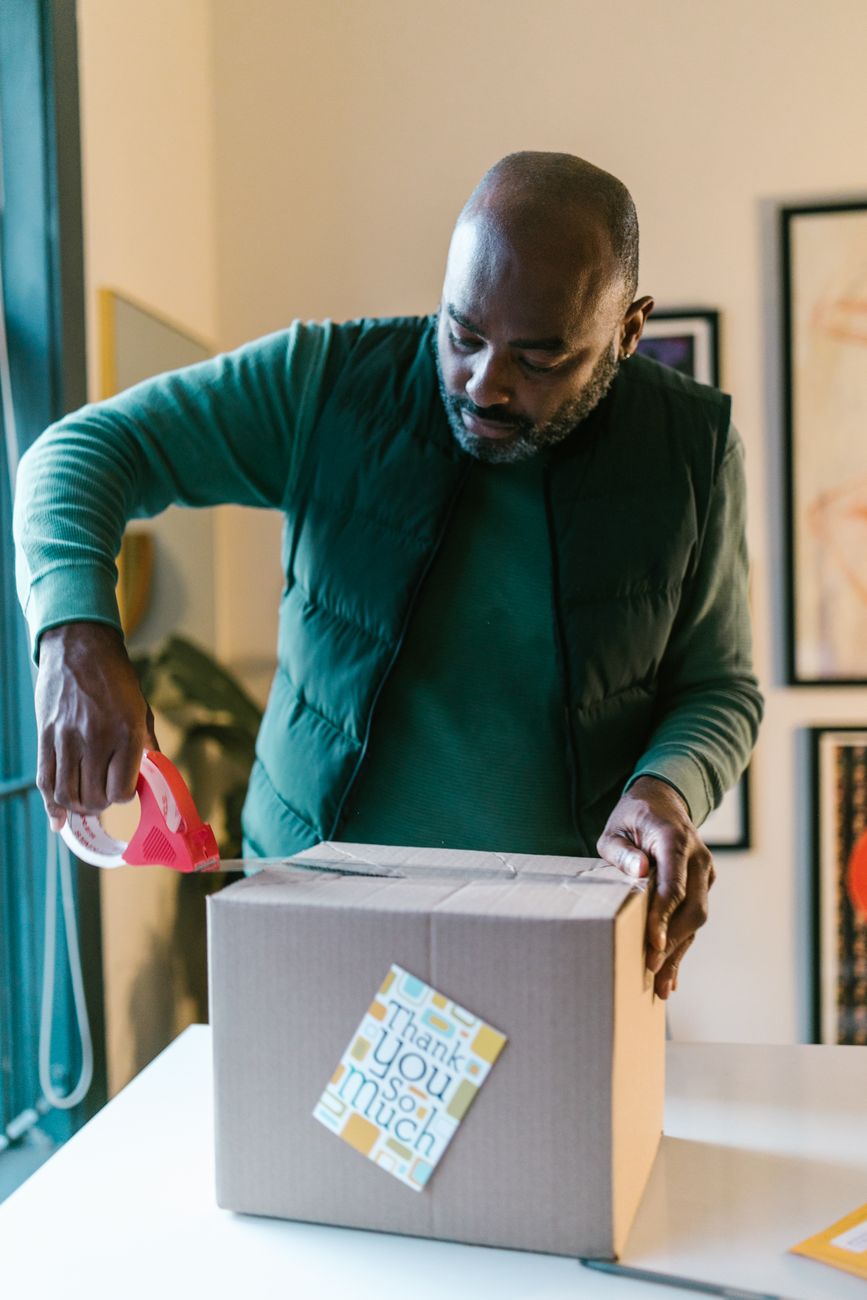 African entrepreneur packaging products for TikTok shop orders