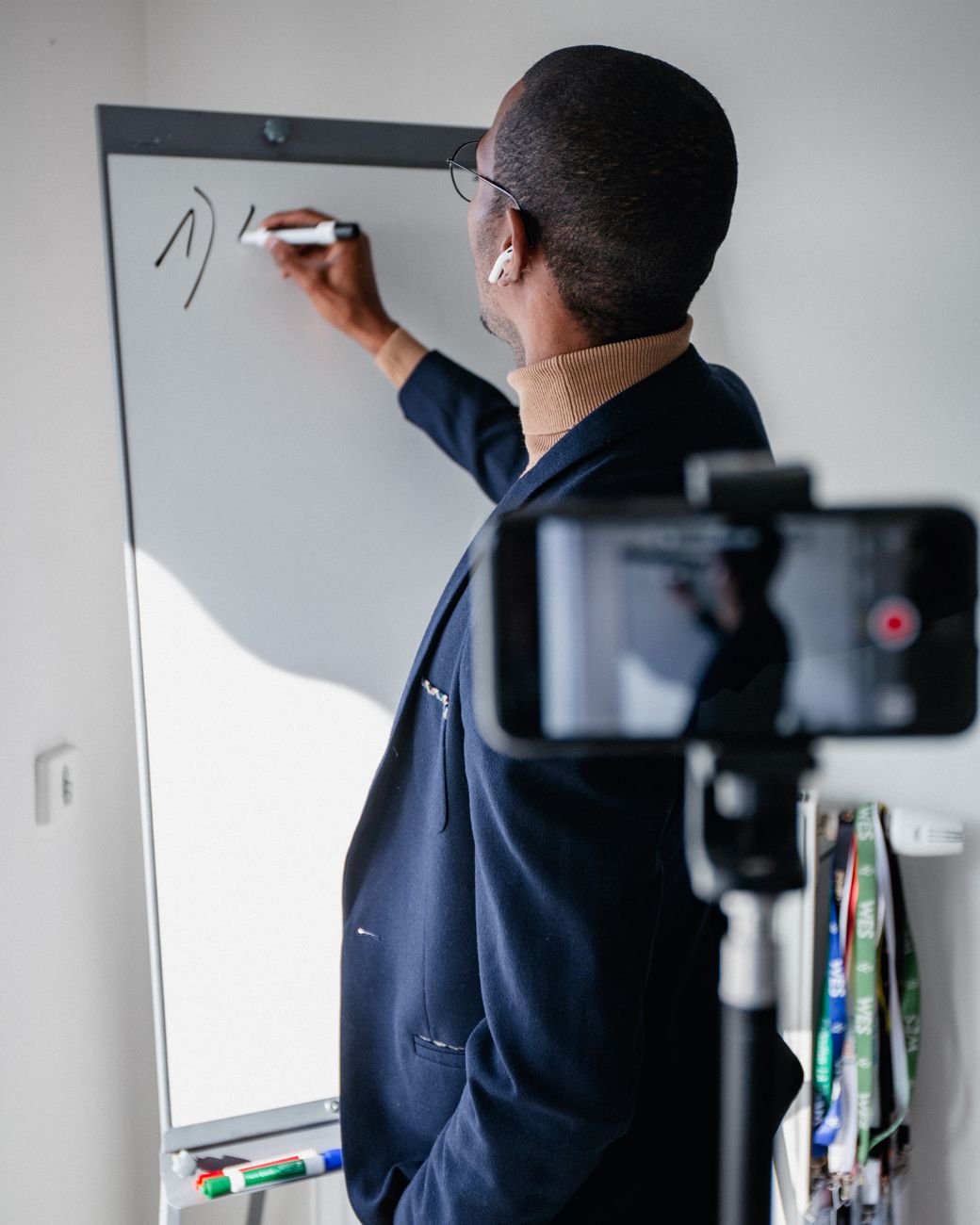 African educator recording an online course on a laptop