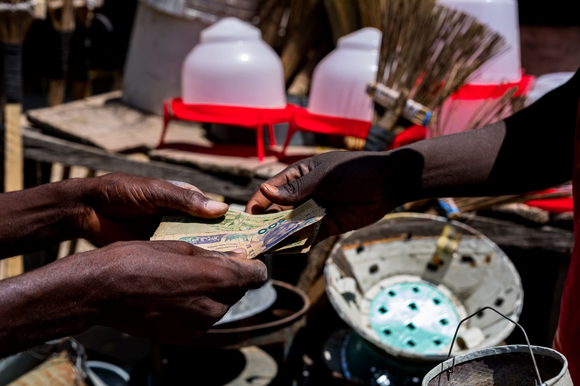 Person using mobile phone for digital payment in Africa