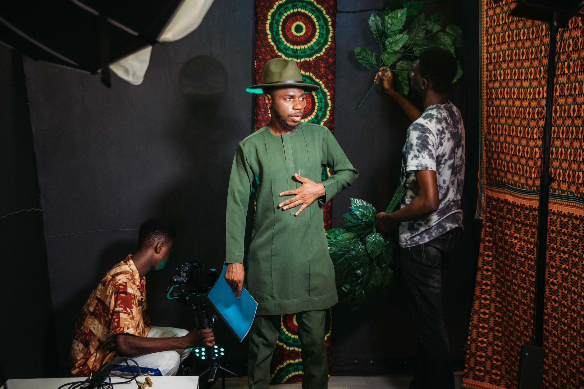 Diverse African creators collaborating on content in a modern studio