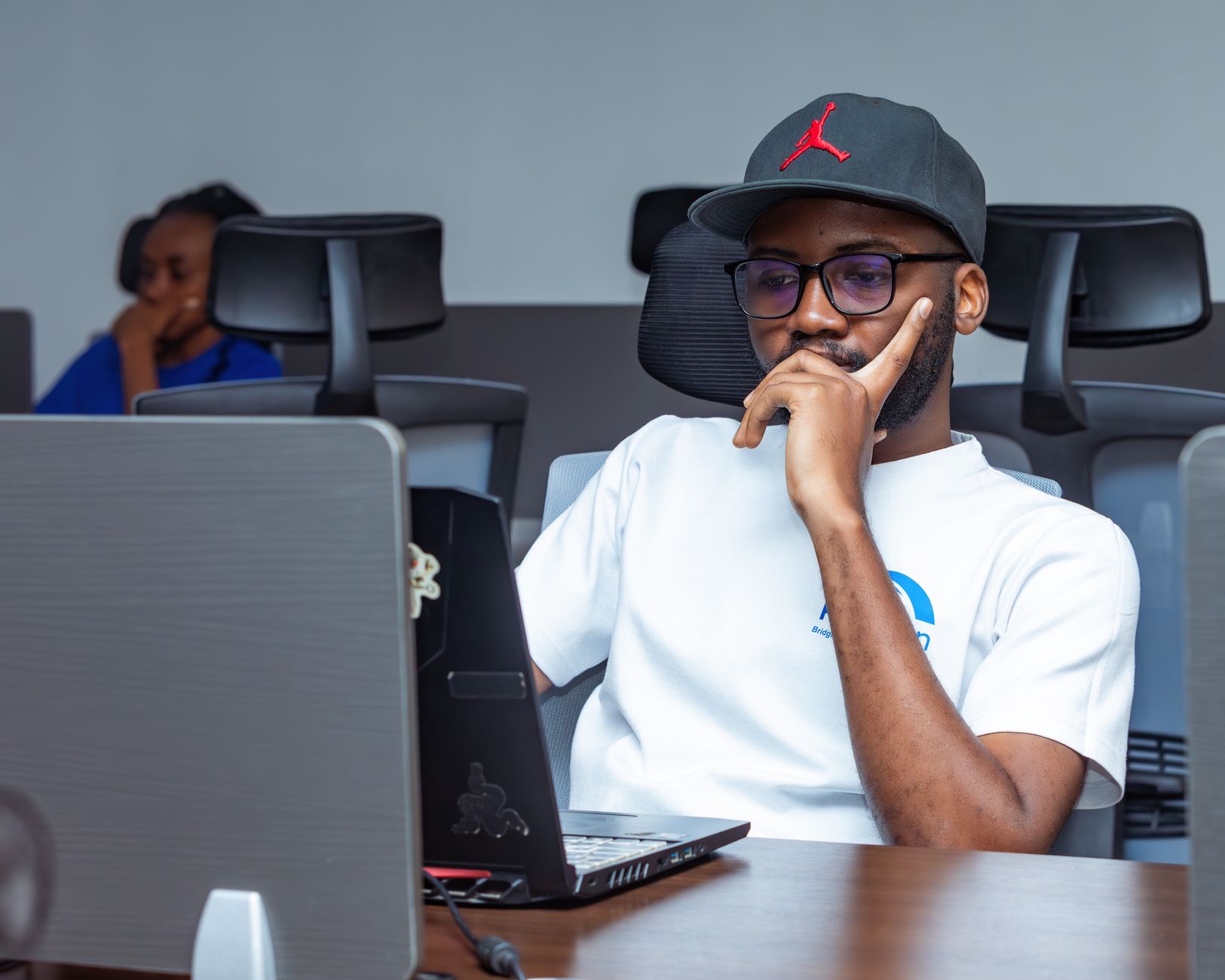 African AI developers writing code at a tech lab in Nairobi