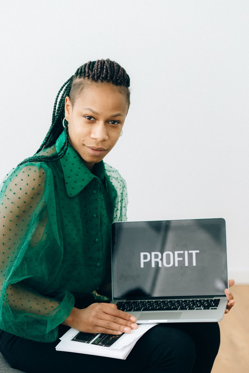 African creator entrepreneur working on a laptop with analytics dashboard
