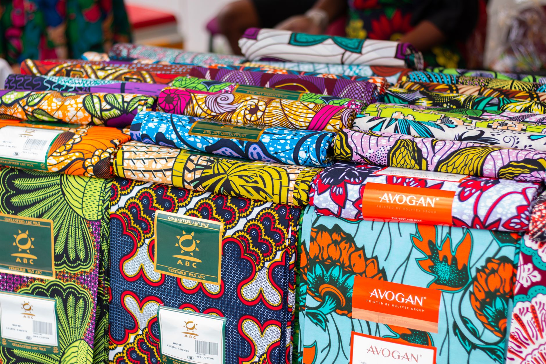 Colorful African Ankara fabric prints displayed at a fashion market