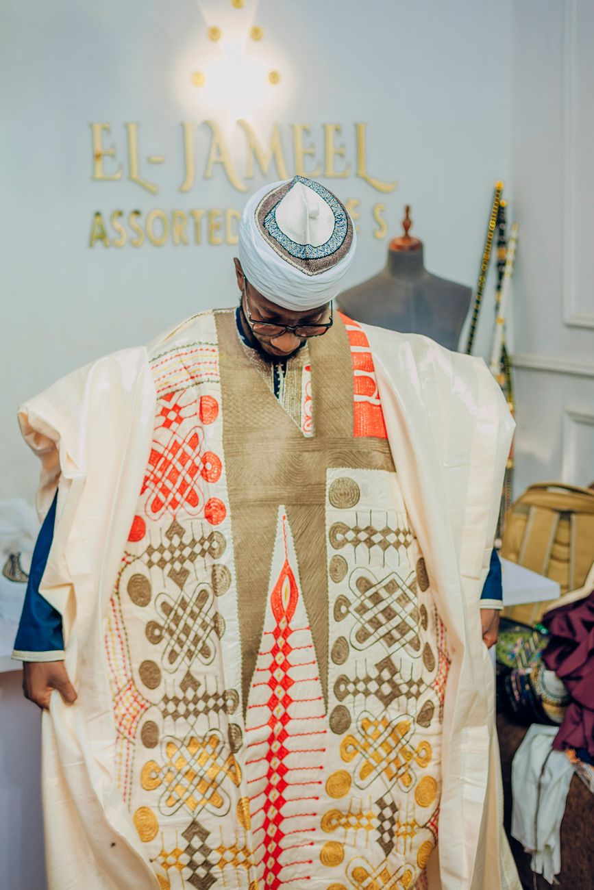 African fashion designer working on Ankara embroidery in a studio