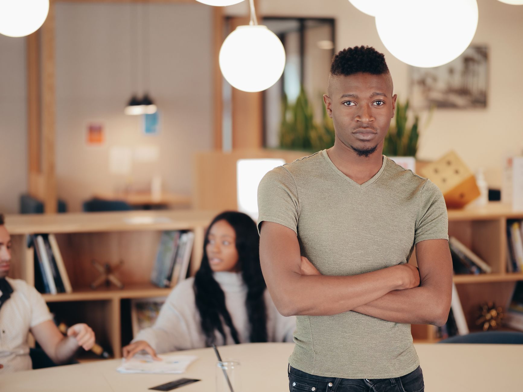 African tech startup founders collaborating in a modern co-working space