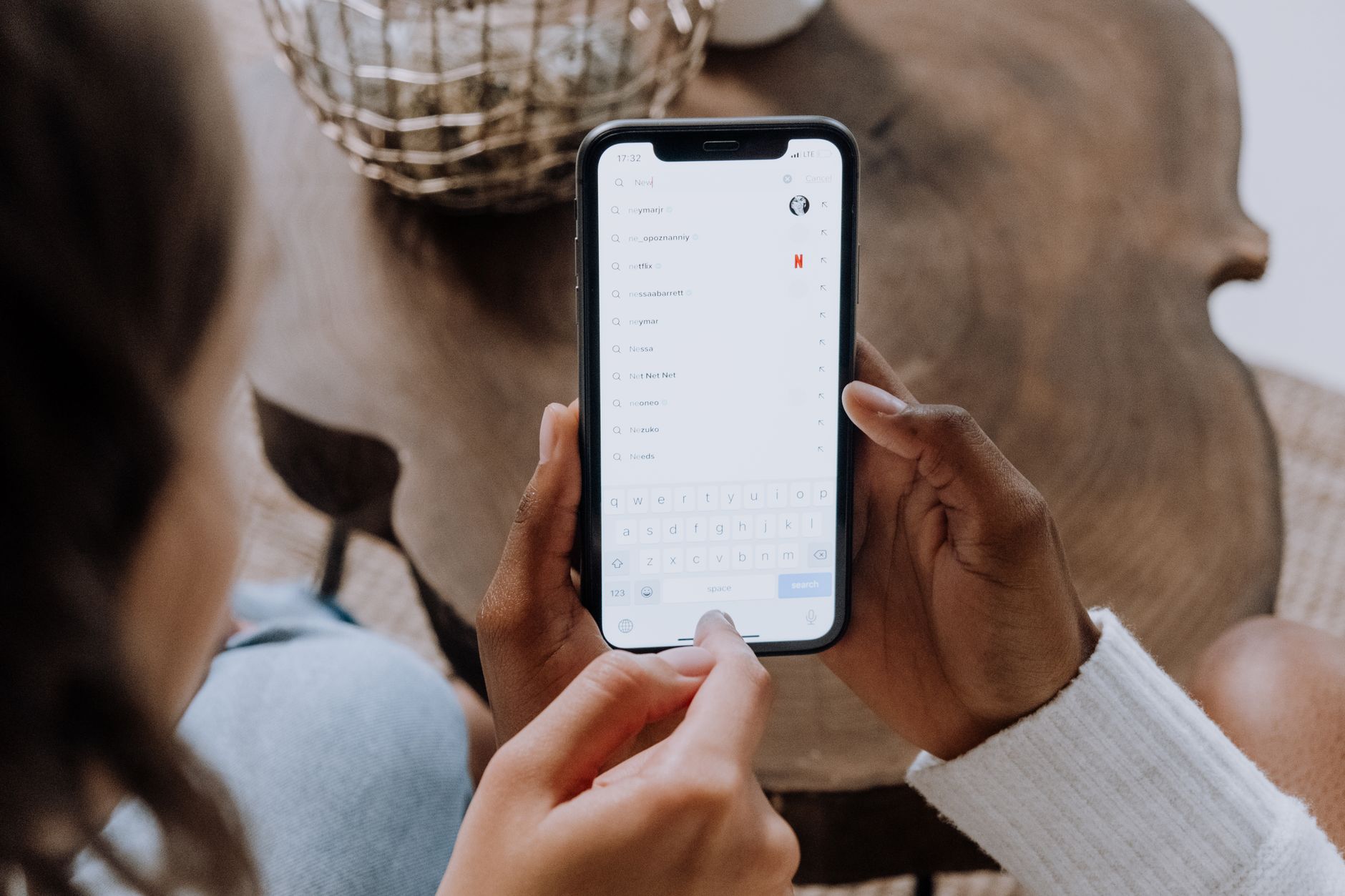 TikTok search bar showing creator discovery results on mobile screen