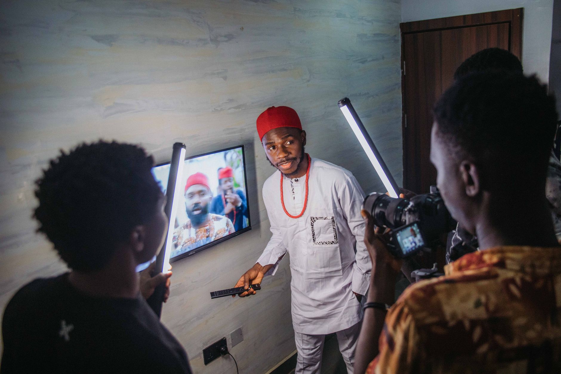Nigerian documentary filmmaker and YouTube creator with camera equipment