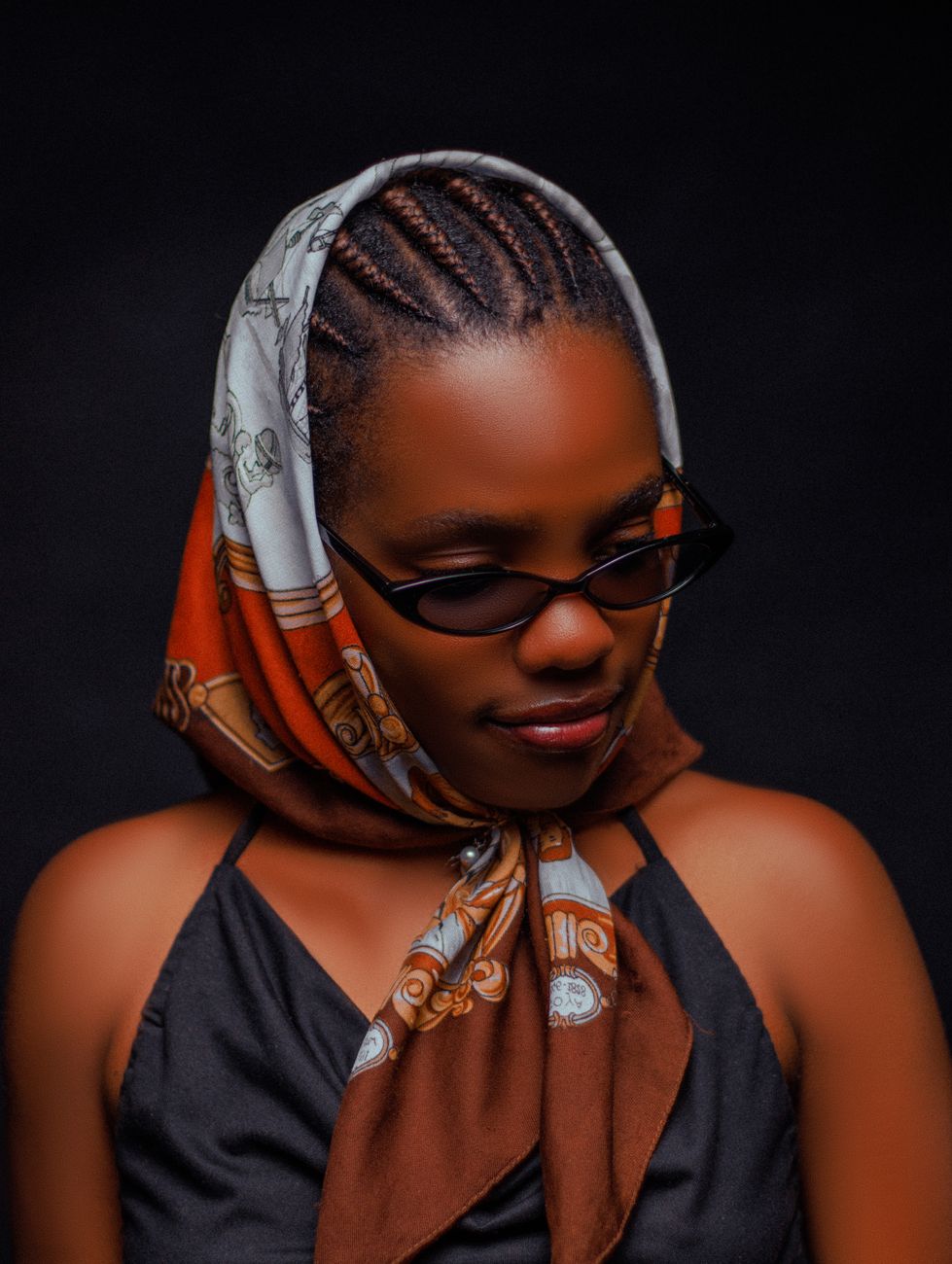 Kenyan female comedian recording a funny video with sunglasses and chips