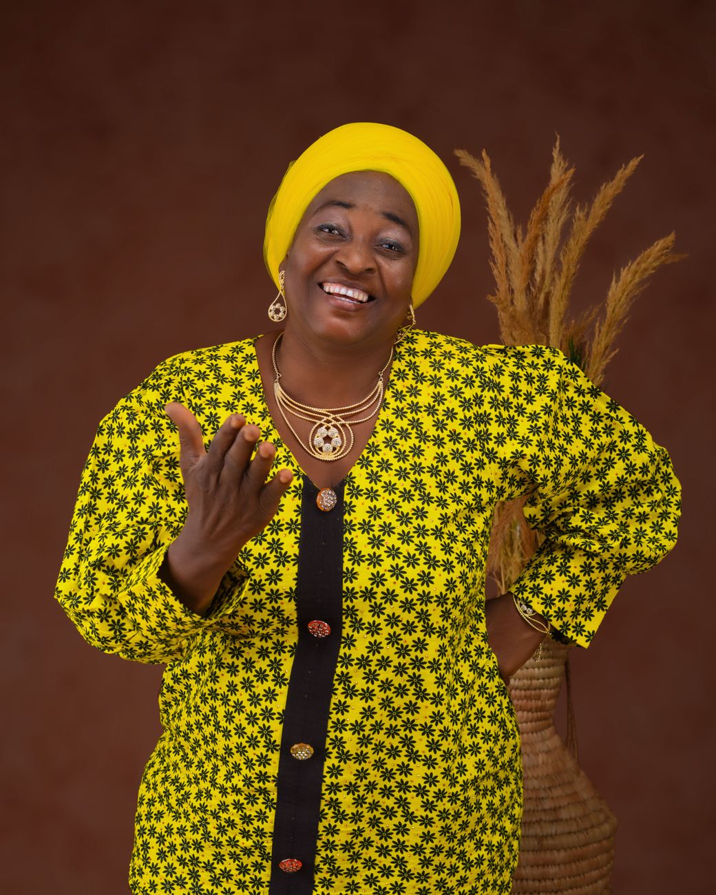 Nigerian female comedian in multiple character costumes for a skit