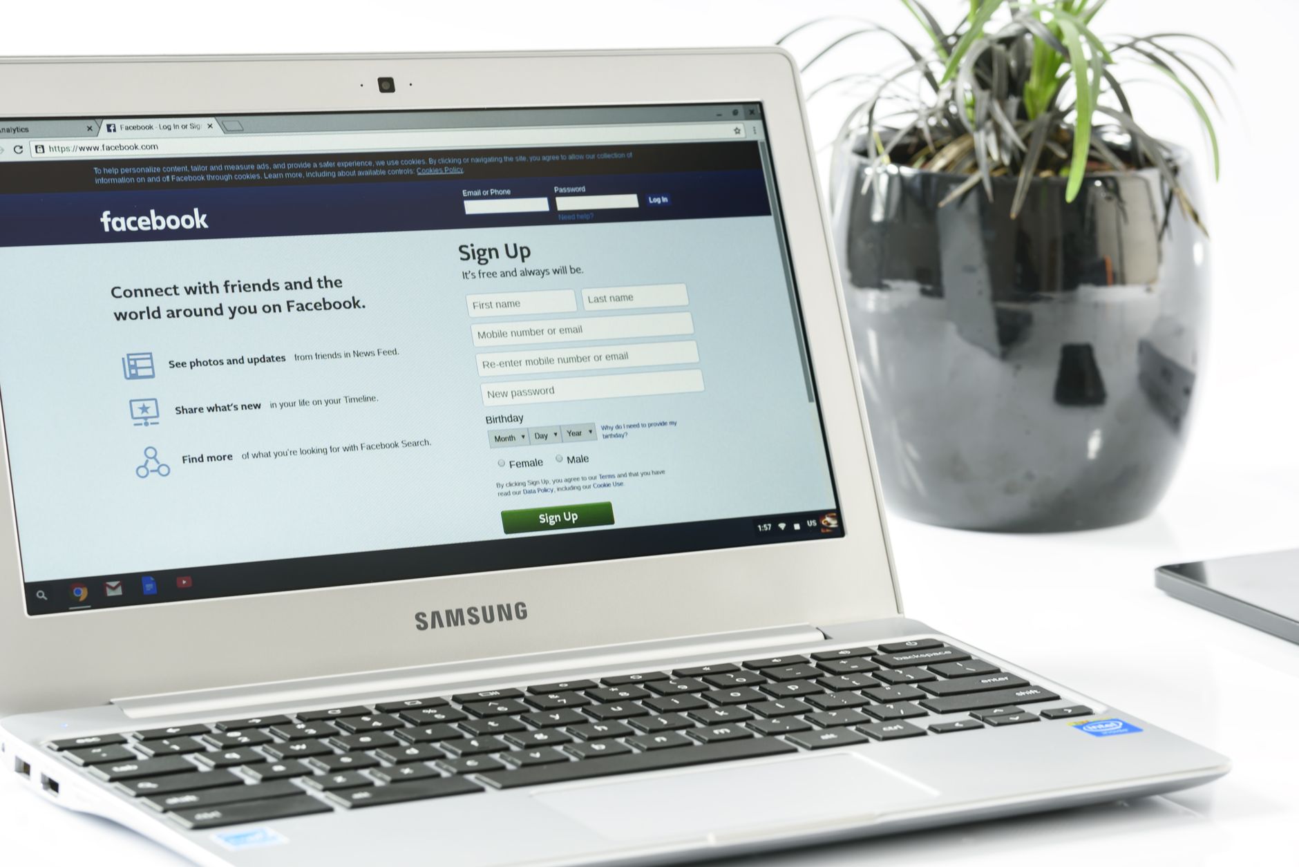Person setting up a professional creator profile on a laptop with social media dashboards visible