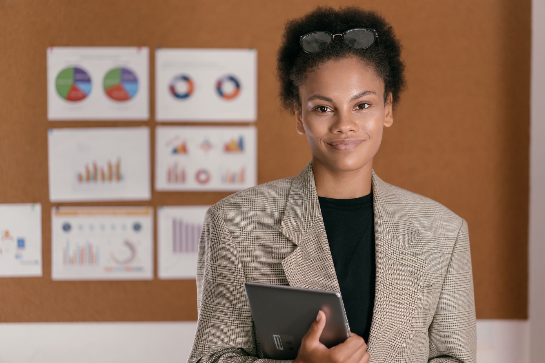 African entrepreneur reviewing monetisation analytics and brand deal contracts on a tablet