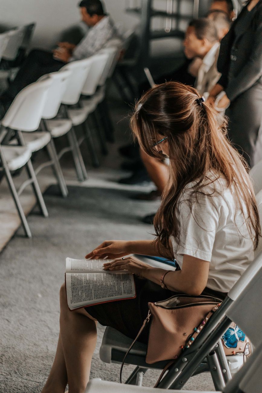 College student with ESV Bible and academic textbooks