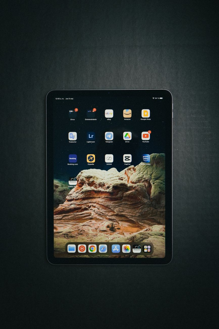 Person using Bible app on tablet with cross references displayed