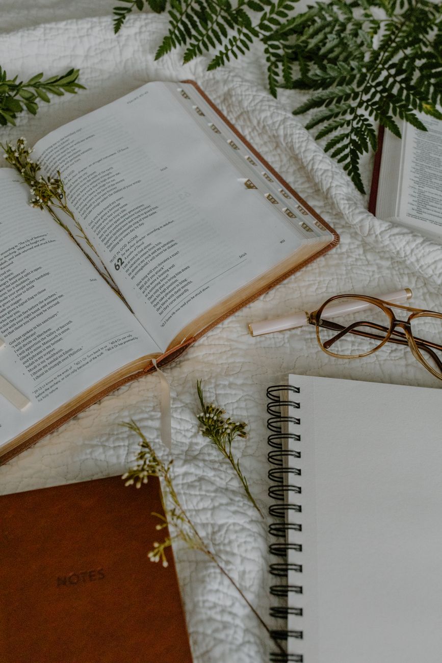 Open Bible with highlighted cross reference verses and study notes