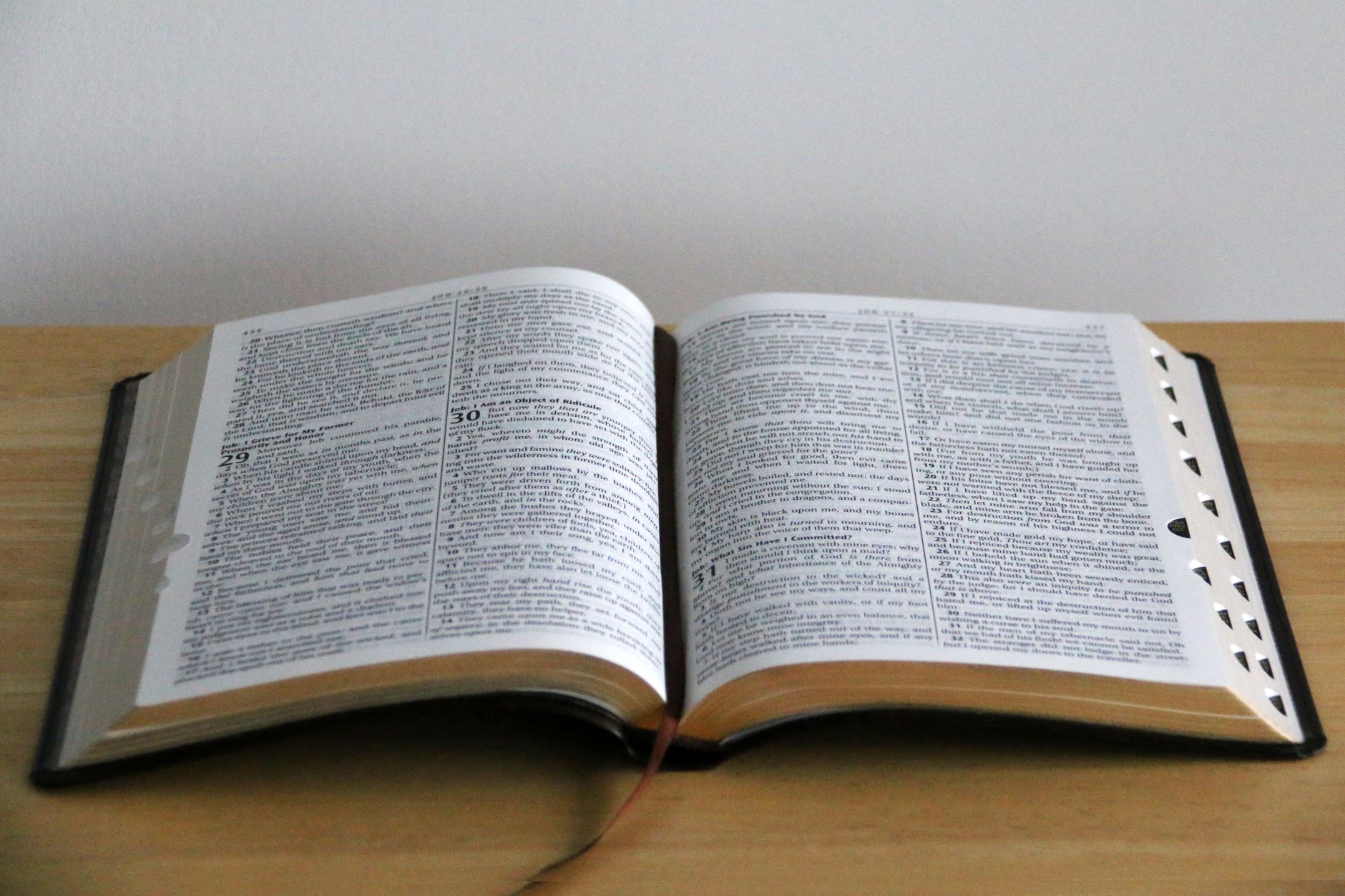 Open Bible with a cup of coffee and a notebook for morning devotions