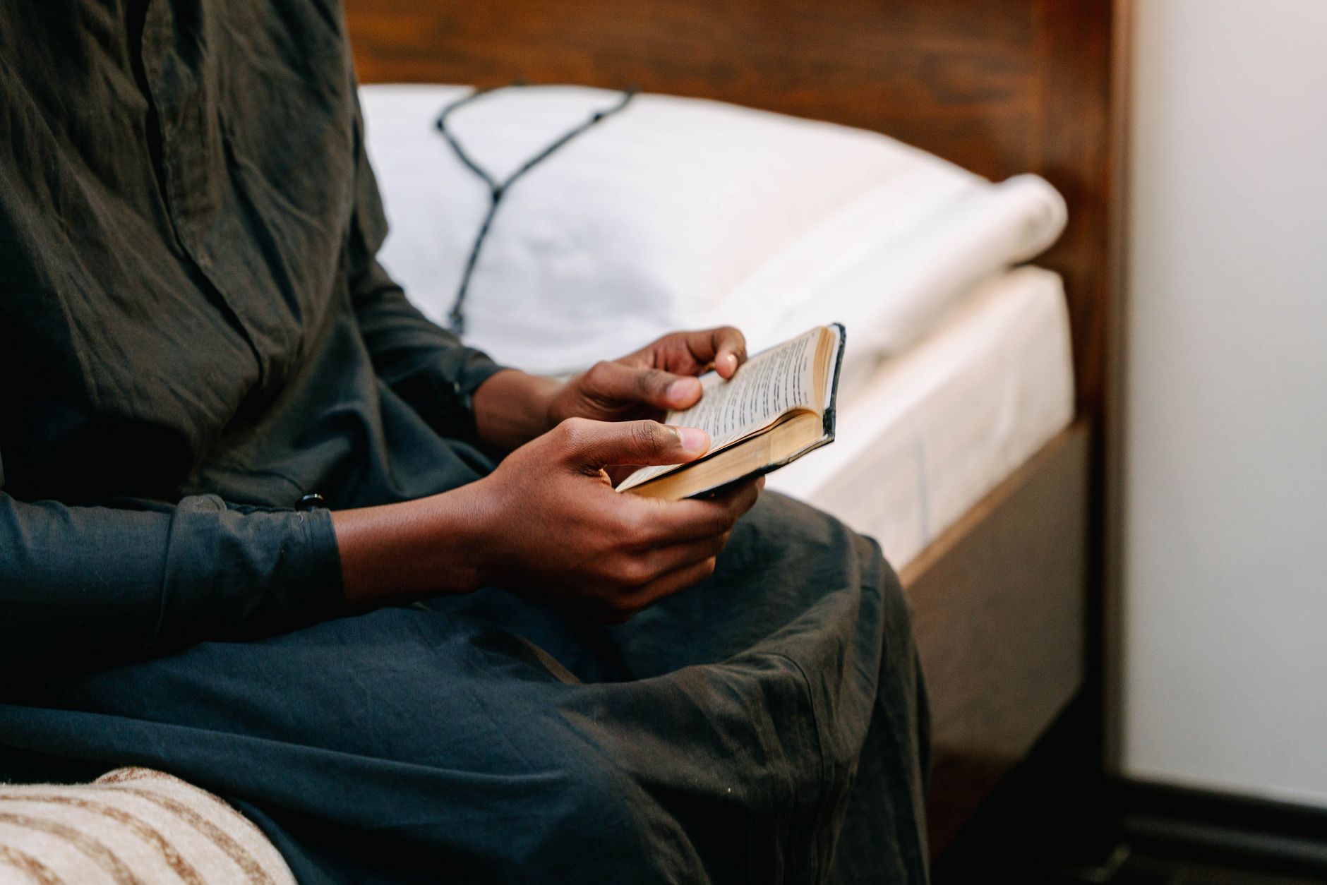 Person reading Bible on Android smartphone with no ads on screen