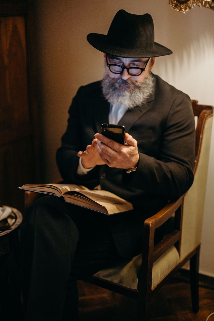 Person using a Bible study app on a smartphone with highlighted scripture verses