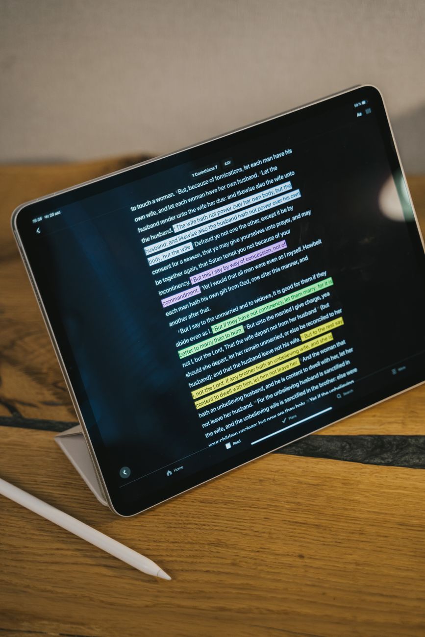 Close-up of a Bible app screen showing cross reference links and verse menu options