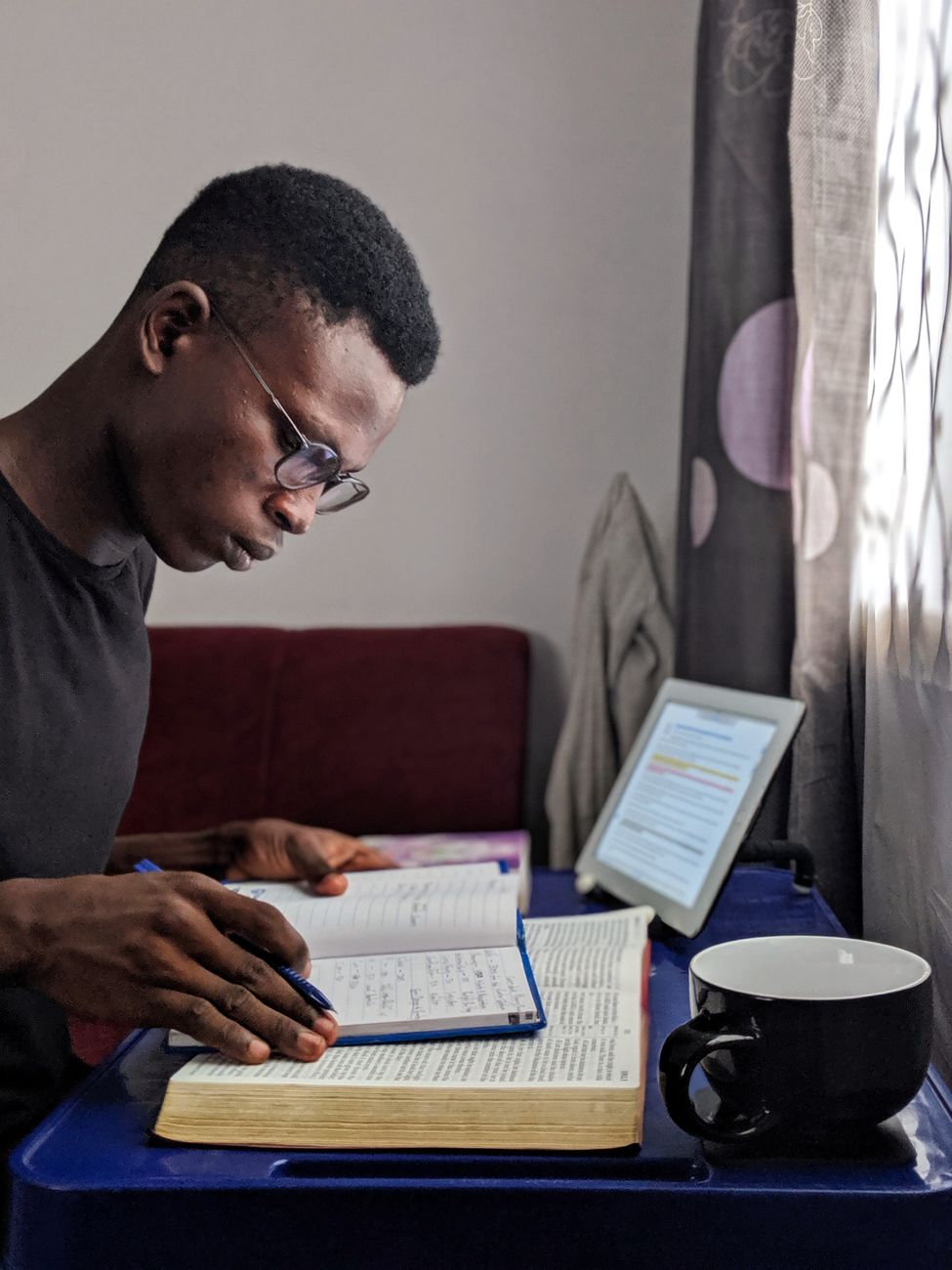 Offline Bible study app open on a tablet in a quiet reading room
