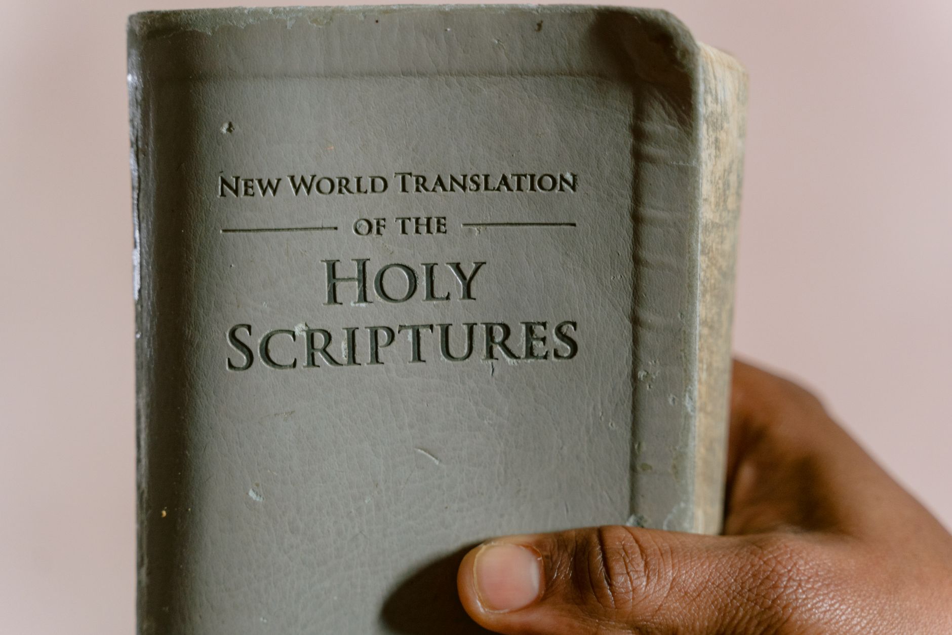 Open Bible showing multiple translation comparisons on a tablet screen