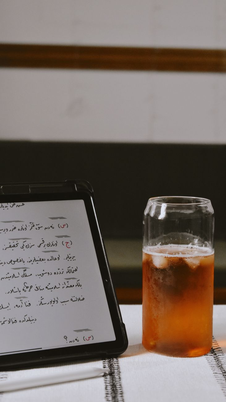 Bible study app open on a tablet showing multiple translations side by side