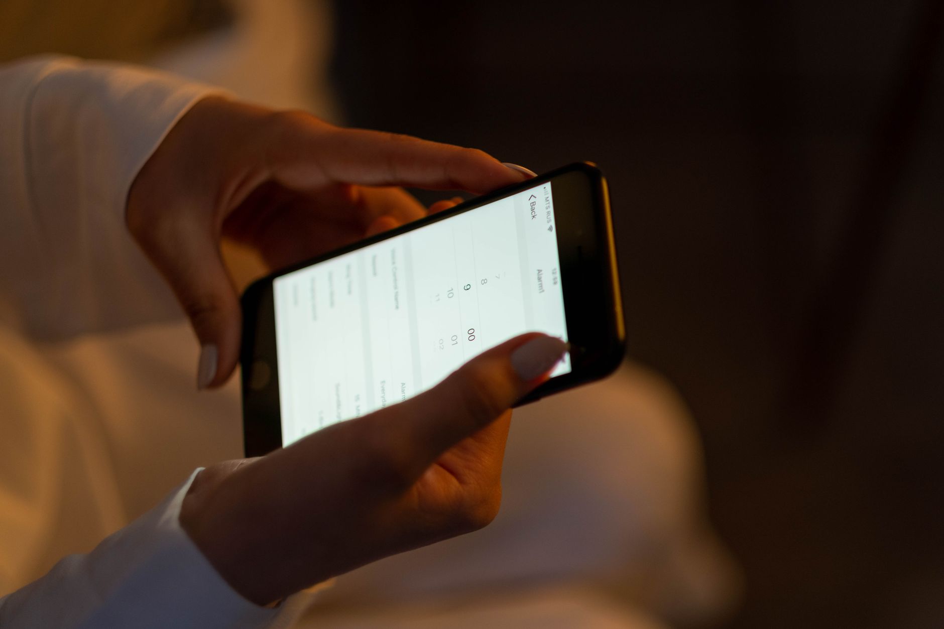 Person using a Bible study app on a smartphone with cross reference links visible on screen