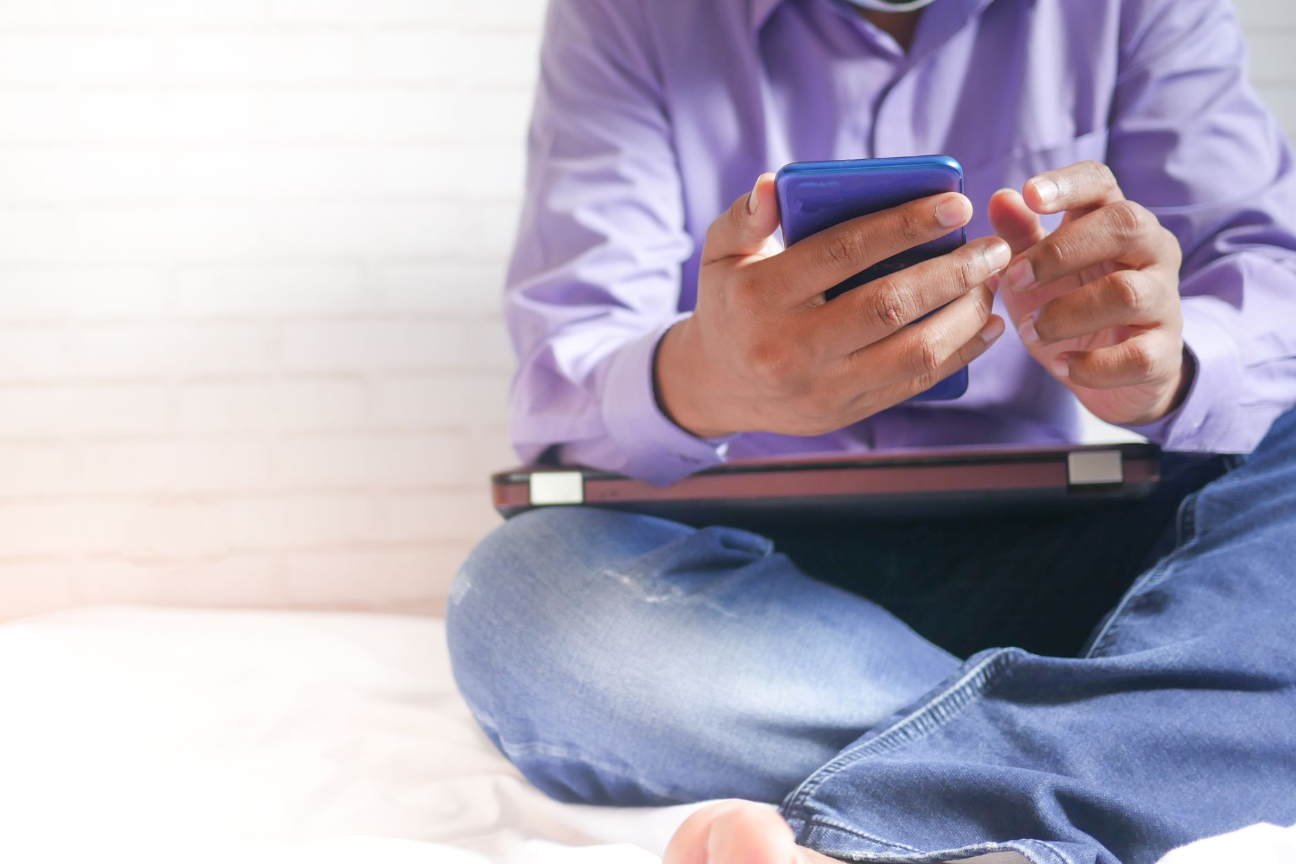 Person reading Bible on a smartphone app with cross-reference notes visible on screen